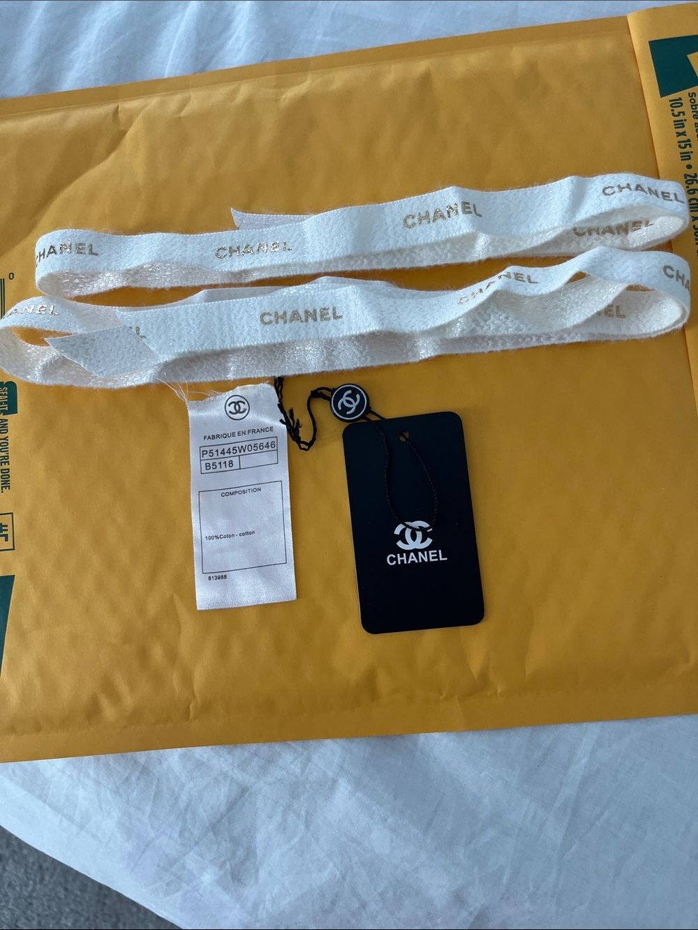 CHANEL White Ribbon with Gold Logo Print